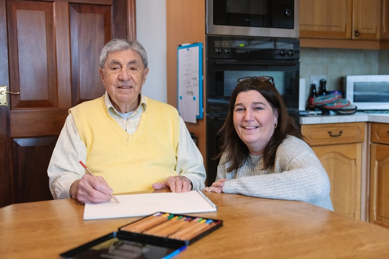 Elderly male client & female Carer