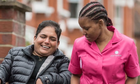 Woman in a wheelchair with an Alina Homecare Carer