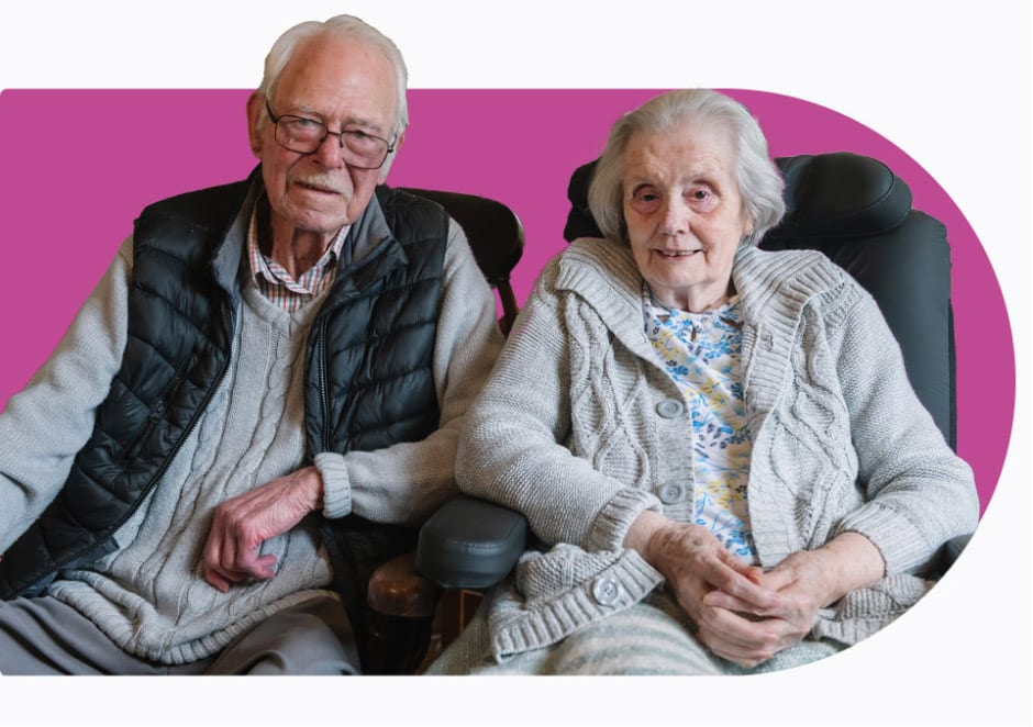 A couple smiling after receiving Home care