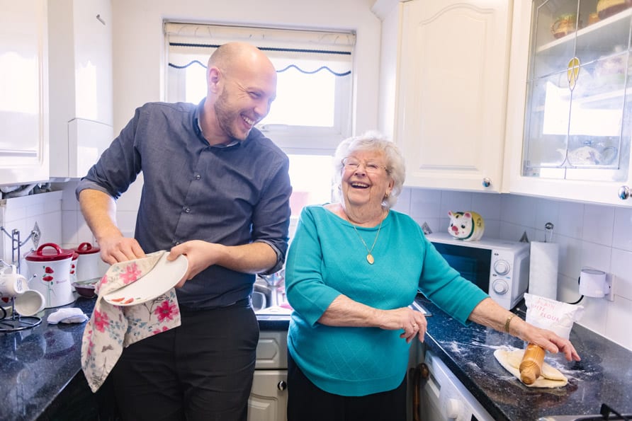 Male Carer & female client preparing food